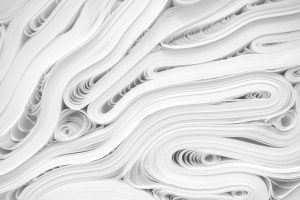 Photo of big piles of white sheets of printing paper